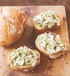 three pieces of bread with chicken salad on them