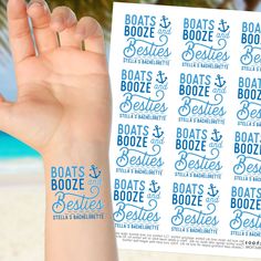 a hand holding up some stickers with the words boats and booze on it