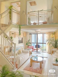 a living room filled with furniture and a stair case in front of a large window