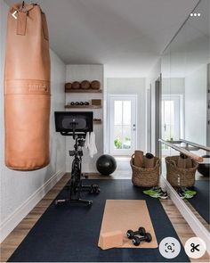 an exercise room with a gym equipment and yoga mat