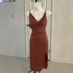 a dress on a mannequin in front of a door