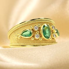 Make an unforgettable entrance with this dazzling gold Emerald Ring - encrusted with dazzling diamonds and fit for royalty! It's the perfect pick to add extravagant style and sparkle to your wardrobe and make an undeniable statement! 100% handmade in our workshop. Metal: 14K Gold| 18K Gold Gemstones: Emeralds | weight 0,68 ct Diamonds | weight 0,08 ct Discover the art of personalization as you select your dream jewelry, choosing the perfect gemstone that resonates with your unique style. Our ded Yellow Gold Diamond Rings For Party, Luxury Gold Diamond Ring With Accents, Luxury Gold Diamond Ring With Diamond Accents, Party Diamond Ring With Accents In Yellow Gold, Gold Rings With Pave Setting For Party, Dazzling Yellow Gold Rings For Party, Yellow Gold Diamond Ring With Accents For Parties, Party Yellow Gold Diamond Ring With Accents, Dazzling Yellow Gold Party Rings