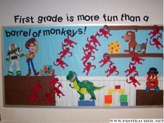 a bulletin board with children's artwork on it in the classroom, including dinosaurs