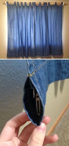 the inside of a pair of jeans is being held up by someone's hand