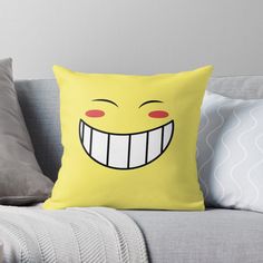 a yellow pillow with a smiling face on it