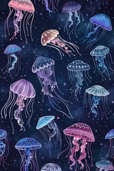 many jellyfish are floating in the water at night, with blue and purple colors