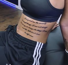 a woman's stomach with the words on it and her name written in cursive writing