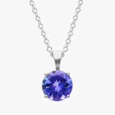 Vibrant and colorful, this gemstone pendant features a lush purplish-blue tanzanite set in a 14k white gold four-prong setting suspended from a dainty 18-inch cable chain. A classic piece of everyday luxury. Tanzanite Necklace, Precious Gemstones Jewelry, Solitaire Pendant Necklace, Everyday Luxury, Blue Tanzanite, Solitaire Pendant, Semi Precious Gemstones, Cable Chain, Gemstone Necklace