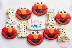 decorated cookies are arranged in the shape of elmo's first birthday