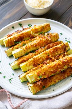 air fryer parmesan zucchini on a white plate