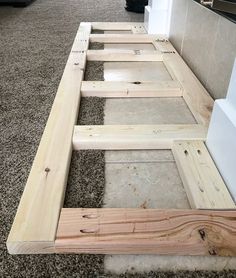 the unfinished bed frame is ready to be built into the floor in the living room