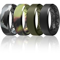 three different types of wedding bands with black and green rings on them, one in the middle