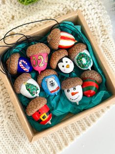 a box filled with christmas ornaments on top of a table