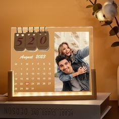 a desk calendar with a couple on it