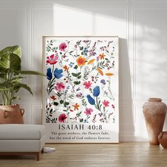 a poster with flowers and birds on it in front of a white wall next to two vases