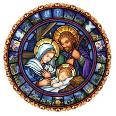 a stained glass window with the birth of jesus and baby jesus in it's lap