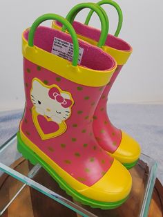 Hello Kitty Pink Green Yellow Rubber Easy Pull On Rain Boots Girls Size 7/8 DESCRIPTION * Slip-on * 2 Handles to make it easy for the little one to pull on and off * Round toe * Non-marking rubber sole * Imported MEASUREMENTS * Size 7/8 * 7" Height CONDITION * Very good condition. Please refer to photos for specific condition of item. "Feel free to email questions if you need more info."  Stock #S16 ljmforu Pink Green Yellow, Hello Kitty Pink, Girls Boots, Rubber Rain Boots, Green Yellow, Rain Boots, Pink And Green, Little One, Rubber Sole