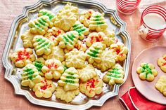 a platter full of christmas cookies with green and red sprinkles