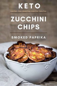 a white bowl filled with fried zucchini chips