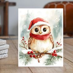 a card with an owl wearing a santa hat