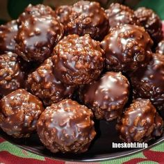 chocolate covered cookies are on a black plate