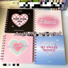 four spiral notebooks with hearts on them and the words aesthetic notebook written in different languages