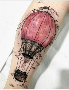 a hot air balloon tattoo on the arm