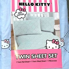 the hello kitty twin sheet set is pink and white