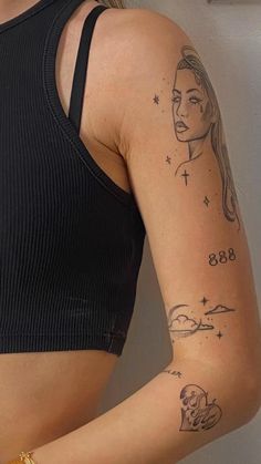 a woman with tattoos on her arm holding a cell phone