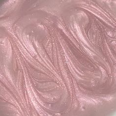 a close up view of some pink liquid