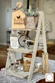 a wooden shelf filled with assorted items on top of a doily covered table