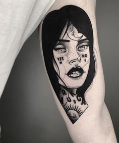 a woman's face with black and white makeup on her arm is shown in this tattoo