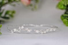 This beautiful choker is made out of a detailed branch design, loaded with lots of little intricate cherry blossom flowers. The branch base is flexible and adjustable. The cherry blossom symbolizes a time of renewal, optimism, beauty, spring, and new beginnings. This piece is meant to carry that energy. Measurements: The circumference is approximately 11 inch / 28 cm. Pls measure your neck to make sure this is a good fit. * Comes wrapped in a beautiful gift bag/box.* Available in 14k gold, rose gold or silver plated brass. For updates, new products, one-of-a-kind's, special offers and more-like us on Facebook:https://www.facebook.com/avigailadamjewellery Follow me on Instagram: https://instagram.com/avigailadamjewelry/