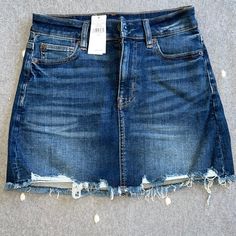 American Eagle Size 2 Distressed Jean Skirt. Nwt Distressed Dark Wash Mini Skirt, Dark Wash Distressed Mini Skirt, Distressed Blue Mini Skirt, Ripped Blue Mini Skirt, Blue Ripped Mini Skirt, Distressed Mid-rise Blue Skirt, Mid-rise Distressed Blue Skirt, American Eagle Skirt, Distressed Jean Skirt