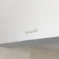 the word be careful is written on the wall