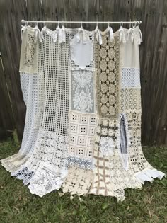 the curtain is made out of crocheted doily