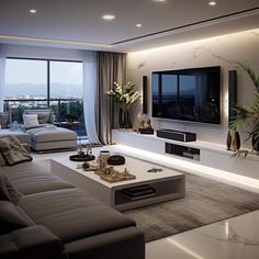 a living room with couches, tables and a flat screen tv on the wall