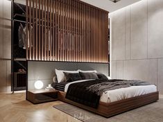 a large bed sitting in the middle of a bedroom next to a wooden headboard