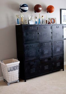 a black locker with basketballs hanging on the wall