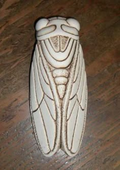 a white object sitting on top of a wooden table