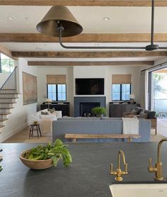 a kitchen and living room with an open floor plan