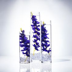 These gorgeous centrepieces are perfect to add a touch of elegance to any event, or home!  This Table Setting will include the following : 🌷1 - 20" x 4" Cylinder Vase 🌷1- 16" x 4" Cylinder Vase 🌷1- 12" x 4" Cylinder Vase 🌷3- Purple Wisteria Strands (not real silk) 🌷3- Floating Candles 🌷1- Bag of Acrylic Crystals Want the flowers only? You can now purchase the flower strand separately from the Link here: 🌷1 Strand is approximately 10" or longer! Questions? Custom Listing? Contact me! 🤓💯 Centerpiece With Floating Candles, Silk Flower Centerpieces, Purple Wisteria, Gorgeous Centerpieces, Flower Centerpiece, Wedding Floral Centerpieces, Blue Orchids, Cylinder Vase, Centerpiece Ideas