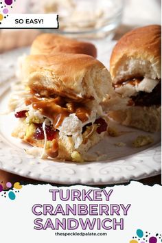 a turkey cranberry sandwich on a white plate with the words, so easy