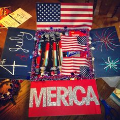 the american flag and other items are laid out on top of a table with writing