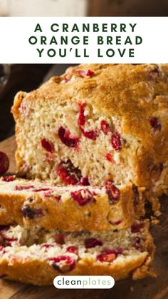 a loaf of cranberry orange bread on top of a wooden cutting board with text overlay