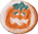 an orange and white plate with a face drawn on it