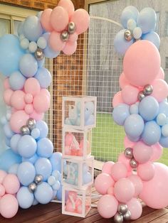 balloons are arranged in the shape of letters and numbers on a table with other decorations