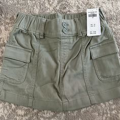 Abercrombie Kids Girls Utility Mini Skirt Sz: 7/8 Color: Green. Nwt High Rise Skort In Lightweight, Knit Twill Fabric, Featuring Utility-Style Cargo Pockets, Built-In Shorts And Double-Buttoned Waist Detail For A Comfortable Fit. Imported. Utility Style, Style Cargo, Abercrombie Kids, Twill Fabric, Lightweight Knit, Kids Bottoms, Mini Skirt, Kids Shop, Built In