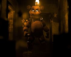 a creepy looking teddy bear holding a lit candle