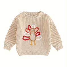 a sweater with a turkey embroidered on the front and back, in beige knits